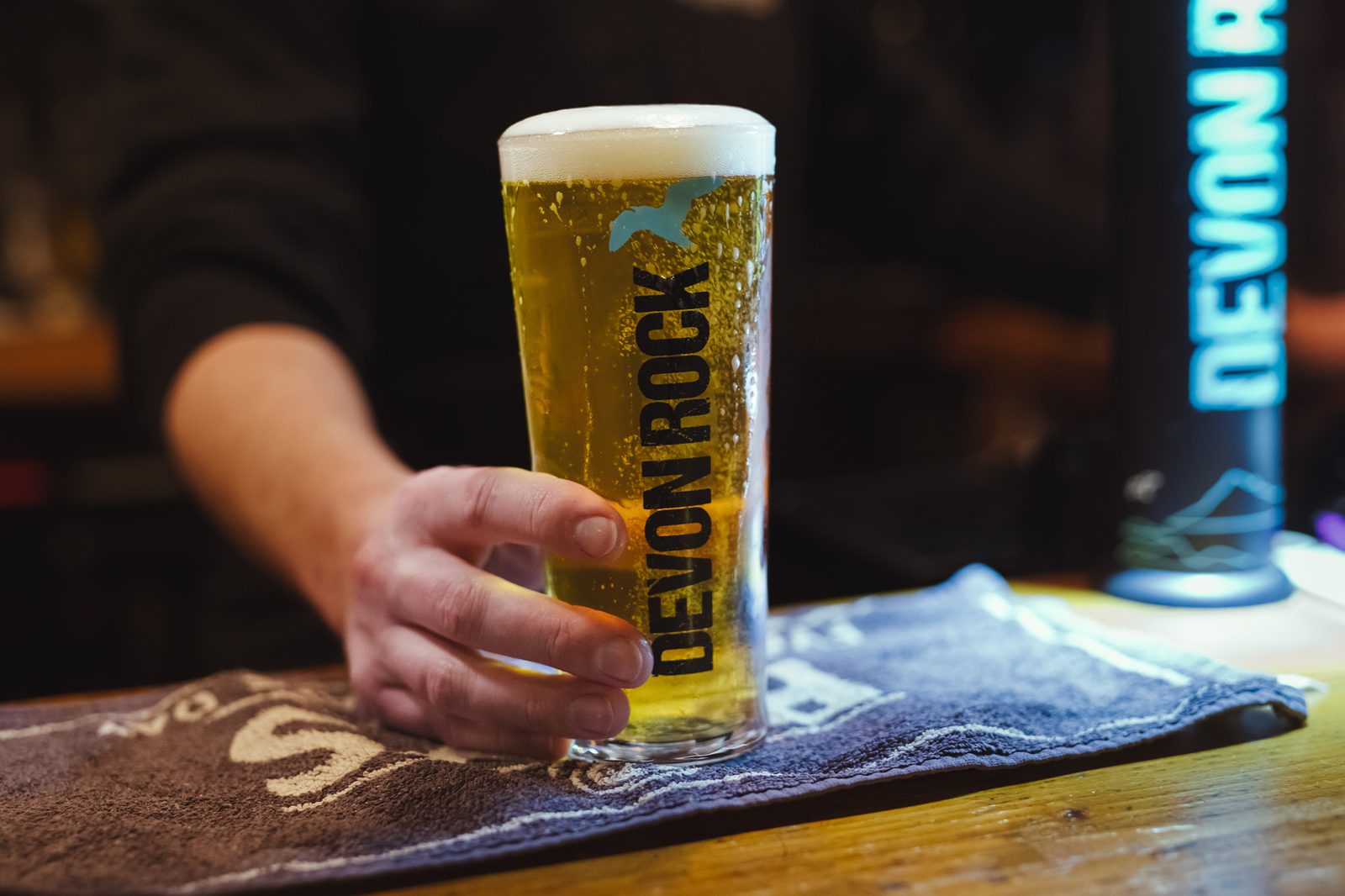 A pint of Bays Devon Rock being placed on the bar